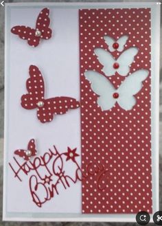 a red and white birthday card with butterflies