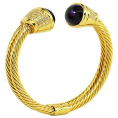 Absolutely stunning 18k yellow gold diamond & Amethyst bangle bracelet. This gorgeous cuff bangle is beautifully crafted in 18K yellow gold and set with two large cabochon Amethysts at both ends. Each Amethyst measures approximately 17.05 x 13.15 mm & bezel set at the top of a tapered design set with natural round brilliant diamonds. 38 diamonds on each side of the bracelet for a total of 76 diamonds, G in color & VS in clarity with the approximate total weight of 1.50 carats. The bracelet has a Yellow Gold Cuff Bracelet, Modern Bangle, Amethyst Bangle, Diamond Cuff Bracelet, Vintage Bangle Bracelets, Yellow Gold Bangle, Vintage Bangles, Diamond Bangles Bracelet, White Gold Set