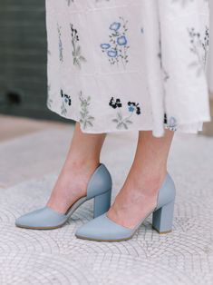 The Ella Heel in Maylis Blue is a comfortable block heel that is as versatile as it is elegant. Features Italian nappa leather in a custom gray-blue color, a pointed toe, d'orsay heel silhouette, and 85mm block heel. French Style Shoes, Sit Still Look Pretty, Wardrobe Aesthetic, Blue French, Stylish Sandals, Elegant Shoes, French Blue, Reception Wedding, Wedge Sneakers