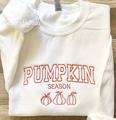 Embroidered PUMPKIN SEASON  sweatshirt. *embroidery thread colors: pumpkin orange/image, black or  white ! -Material is 50%cotton and 50%polyester. -This is unisex fitting sweatshirt:Size chart is listed in images!  -FYI:I do rotate sweatshirt brands based on size and availability in stock. Measurements,quality and fitting is equal to one another! -Size up for "oversize" look! **Shirt is made to order, and processing times is estimated 5 business days!  *Due to nature of Handmade goods this order is not allowed for returns or exchanges, but if you have any concerns, please do contact me and I would be happy to help you! Oversized Fall Sweatshirt, Fall Embroidery Designs Sweatshirt, Fall Embroidered Sweatshirts, Sweatshirt Brands, Embroidered Pumpkin, Preppy Wardrobe, Fall Embroidery Designs, Fall Crewneck, Sweatshirt Embroidery