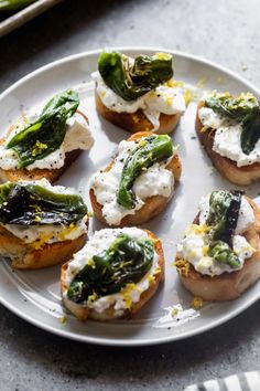 small appetizers with cream cheese and asparagus on a plate