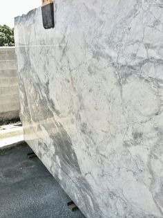 a large marble slab sitting in the middle of a parking lot