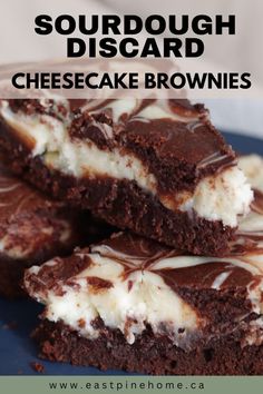 some brownies are stacked on top of each other with white chocolate drizzle