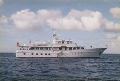 a large white boat floating on top of the ocean