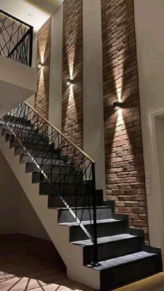 a stair case with two lights on the side and some stairs in front of it