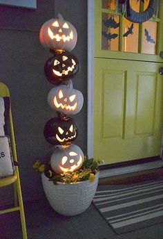 pumpkins are lit up in the shape of jack - o'- lanterns