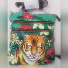 This Is A Rare Gorgeous Artistic Handpainted Lion With Flowers Panting, Lots Of Pockets And No Call Out . Comes With Dust Bag And Its Plastic. Hand Painted Crossbody Travel Bag, Hand Painted Crossbody Bags For Travel, Artistic Hand Painted Travel Bags, Hand Painted Green Bags For Everyday, Everyday Use Hand Painted Green Bags, Artistic Hand Painted Shoulder Bag, Hand Painted Green Rectangular Shoulder Bag, Green Hand Painted Tote Bag, Green Hand Painted Rectangular Shoulder Bag