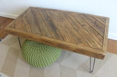 a wooden table sitting on top of a green ball