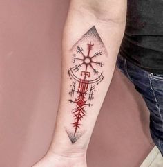 a person's arm with a tattoo on it and an arrow in the middle