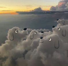 several clouds with faces on them floating in the air, and one is looking up at the sky