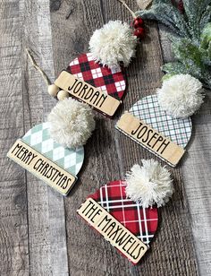 three christmas ornaments on top of a wooden table