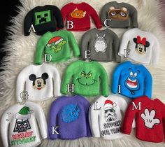 the children's mickey mouse sweaters are all in different colors and sizes, including one