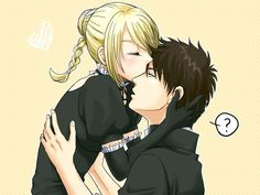 two people are hugging each other and one is wearing a black hoodie, the other has blonde hair