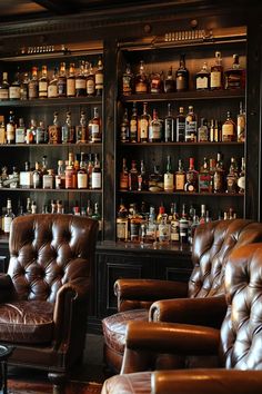 a room with leather chairs and shelves full of liquor bottles