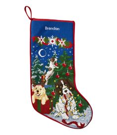 a christmas stocking with dogs and snowflakes hanging from it's side