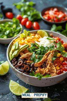 a bowl filled with chicken, black beans and cilantro