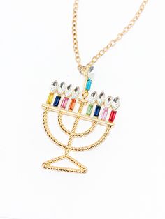 "Handmade in Portland, Oregon.  This is the Hanukkah necklace you've been looking for! Sparkly, beautiful and the best statement!  MEASUREMENTS + MATERIALS - Length is about 20 inches and is adjustable by 1-2 inches - The colored rhinestones make the prettiest statement  - Gold plated chain for sensitive skin (hypoallergenic) - Let me know if you need another length and I'll see if I have the availability to accommodate you!  WHAT PEOPLE SAY \"Beautiful craftsmanship, these were for my mother in Hanukkah Gift Pendant Jewelry, Hanukkah Gift Necklace With Star Of David, Star Of David Necklace For Hanukkah Gift, Hanukkah Jewelry, Hanukkah Gift Ideas, Pretty Box, Menorah, Christmas Jewelry, Cute Christmas