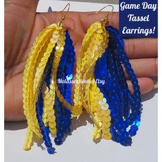 We At Molasseshoops Pride Ourselves on Designing and Finding Unique Affordable Products For All of Mankind that Will Bring You Compliments For A Lifetime 🌹We Are The Original Designers Of The Sequin Tassel Earrings & We Do It Best [PHOTO COLORS: Royal Blue,Yellow, Gold/ Regular Green, Yellow, Gold] Introducing Our Newest Edition To Our Custom "Inspired Team Color" Sparkle Tassel Earrings Collection. These "GAME DAY" Sparkle Beauties Will Surely Standout From The Crowd When It's Time To Show You Short Hair Dos, Sequin Earrings, Diy Tassel Earrings, Diy Tassel, New Game, Pretty Packaging, Ear Candy, School Colors, Fabric Jewelry