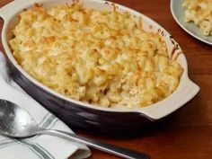 a casserole dish with macaroni and cheese in it on a table