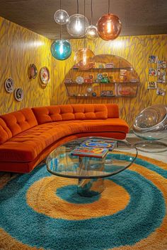 an orange couch sitting in front of a glass table on top of a blue rug