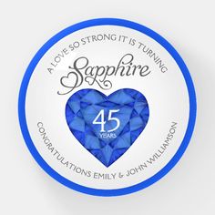 a blue and white badge with the number 45 on it that says, a love so strong is turning sapphire