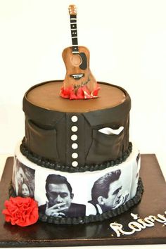 a cake decorated with an image of two men and a guitar on the top tier