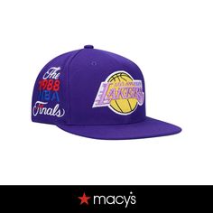 a purple hat with the los lakers logo on it and words written in different languages