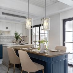 a kitchen with blue cabinets and white walls