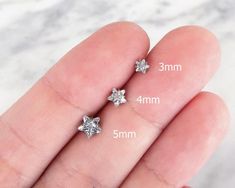 ♥ Listing is for 1 piece. Not a pair ♥★ 16g Cartilage Earring, CZ Star, Cartilage Piercing, Ball Back Stud ★♦ Bar size:  16 gauge (1.2 mm)♦ Length:  1/4" (6mm)♦ Materials: 316L surgical steel, CZ crystal (cubic zirconia).♦ Suitable for: cartilage, tragus, helix, conch, labret, monroe piercings♦ Comes in a waterproof vinyl bag, ready for gifting and can be used for storing your jewelry after use.----------------------------------------------------------All shipping comes with Tracking Numbers.Shi Nickel Free Star Shaped Silver Cartilage Earrings, Nickel Free Silver Star-shaped Piercing, Nickel-free Silver Star Piercings, Nickel-free Star-shaped Silver Piercings, Silver Star Shaped Internally Threaded Piercings, Silver Star Internally Threaded Piercings, Silver Star-shaped Internally Threaded Piercings, Tiny Star-shaped Piercings For Gift, Dainty Star-shaped Piercings As Gift