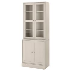 a white cabinet with glass doors and shelves on the front, against a white background