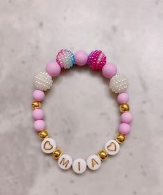 "This is a unique and cute custom bracelet for any little girls! The personalized name could be the first spelling lesson for your little girl to write her own name! All orders come with 1 personalized name bracelet and there are 3 different beaded options to choose from. 📬 If you want your order to deliver by Christmas, please select \"Priority Shipping\"! All options use golden letter, heart beads, and spacer beads. Option 1: Rainbow rhinestone beads mixed with white faceted beads, yellow mat Playful Customized Bracelets For Gifts, Adjustable Custom Name Bracelets For Party Favors, Personalized Adjustable Beaded Bracelets For Birthday, Cute Adjustable Beaded Bracelets With Custom Name, Customized Pink Adjustable Name Bracelet, Customized Pink Name Bracelet With Adjustable Fit, Customized Pink Name Bracelet Adjustable, Personalized Pink Name Bracelet For Party Favors, Customizable Cute Name Bracelet Adjustable