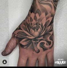 a person's hand with a tattoo on it and a flower in the middle