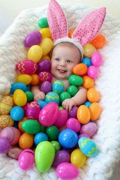 an image of a baby in a basket full of easter eggs with the caption memesa lee jones shared good living guide