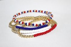 Red, white, and blue themed bracelets. This stack is perfect for the Fourth of July, Memorial Day and Labor Day! These bracelets are made with 4mm gold plated beads and 4mm glass seed beads. Message me to customize if needed.  All bracelets are made to order and are final sale.  Please see sizing graphic to ensure correct size. White Patriotic Bracelet As Gift, Patriotic Bracelet, Navy Army, Blue Beaded Bracelets, Military Support, Bracelets Design, Beads Bracelet Design, Star Bracelet, Bracelets Handmade Beaded