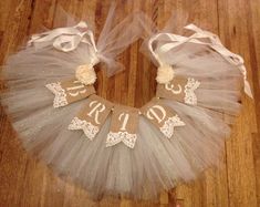 a white tutu skirt with the word bride on it and two ribbons tied to it