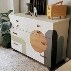 the dresser is painted in different colors and shapes