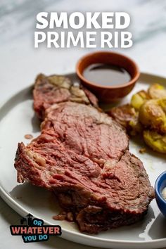 a white plate topped with steak, potatoes and dipping sauce