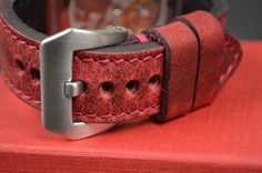 RECOMMENDATION FOR STRAP LENGTH : WRIST SIZE 15-17 CM - 115/75 MM STRAP LENGTH WRIST SIZE 17,5-19 CM - 130/80 MM STRAP LENGTHCaracteristics: Model : VINTAGE - BOX RED I Genuine BOX - CALF LEATHER Color : Red Handmade ONLY VALID FOR TANG BUCKLE (PHOTOS) Width : 26/24/22 mm (at the watch) - 26/24/22 mm (at the buckle) Length : 130 / 80 mm - 115 / 75 mm Thickness : aprox. 3,5 - 4 mm Edges : burnished - matte Keeper : 1 fix + 1 floating Inox. tubes included (Width 26 + 24 mm) Waterproofed: NO Logo s Red Leather Watch Accessories For Everyday, Red Leather Watch Bands For Everyday Use, Red Leather Strap Watch Bands As Gift, Red Leather Watch Bands For Gift, Red Leather Watch Bands For Gifts, Red Leather Watch Bands As Gift, Vintage Red Watch Accessories For Gift, Red Rectangular Watch Band With Bracelet Strap, Red Leather Watch Accessories For Gift