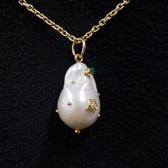 1. Diamond Pearl 18k Gold Pendant 2. Natural Arizona 3. Gemstone - Pearl, Diamond, Emerald, Ruby 4. Jewelry Type - Pendant 5. Total Weight - 5.440 Grams 6. Pearl Weight - 23.85 Carat Approx 7. Diamond Weight - 0.03 Approx 8. Ruby Weight - 0.04 Carat Approx 9. Emerald Weight - 0.05 Carat Approx 10. Gold Weight - 0.646 Grams Approx 12. Gold Purity - 18k 13. Charms Jump ring Outer Size - 7 mm 14. Drilled stone 15. Ready to dispatch in 1 - 2 days. 16. Handmade Items 17. AAA Quality 18. Price per pie Ruby Emerald, Emerald Pendant, Pearl Gemstone, Pearl Diamond, Jump Rings, Gold Pendant, Jewelry Necklace Pendant, Ruby, Emerald