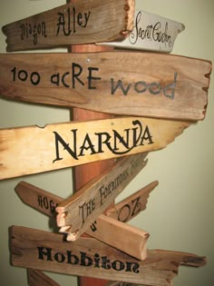 a wooden sign with many names on it that says, 100 acr - wood narnda