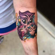 an owl and two owls tattoo on the arm