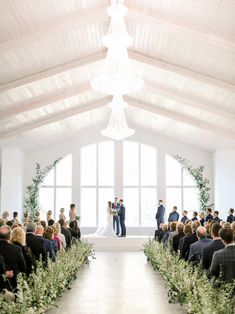 a couple getting married in front of an audience