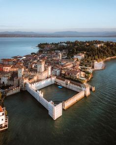 an aerial view of a city on the water