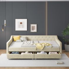 a living room scene with focus on the daybed and shoe storage compartment in the foreground