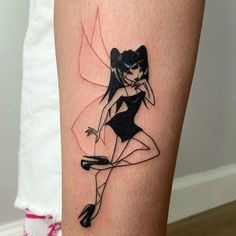 a woman with a tattoo on her leg