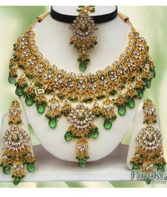 "Latest Pearls Touch Bollywood Wedding Designer Bridal Kundan Zircon Choker Necklace Jewelry Earrings,Tikka Set. This product is handmade & hence the product can be non-uniform & vary in color & texture. Color : Green Gorgeous Zircon Gold Plated Necklace jewelry Set 1.Set consists of Necklace, Earrings, Maang Tikka Set 2. Necklace Size:(5.5\"L X 6.5\"W) 3.Necklace Weight: 145 Gm 4.Earrings Length:3.5\" 5.Tikka Length: 5\" EXPEDITED DELIVERY (Chargeable) : Delivered 3 to 4 working day Green Bridal Earrings For Reception And Festivals, Green Kundan Jewelry For Wedding, Green Meenakari Bridal Earrings For Wedding, Green Hand Set Jewelry For Marriage, Green Hand-set Jewelry For Marriage, Green Wedding Jewelry For Festive Season, Green Festive Wedding Jewelry, Festive Green Wedding Jewelry, Bollywood Style Green Bridal Sets Gift