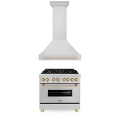 a white stove top oven sitting next to a wall mounted oven with gold knobs