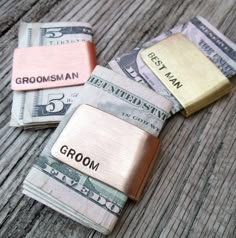 three different types of money sitting next to each other on top of a wooden table