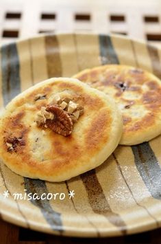 two pancakes sitting on top of a striped plate