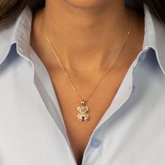 Elevate your jewelry collection with the Adina Eden Pave Colored Teddy Bear Pendant Necklace, a stunning blend of playfulness and sophistication. This exquisite piece features a bear pendant, measuring 18mm, crafted from high-quality brass and coated in a lustrous 14K gold plating. Each detail of the bear is brought to life with clear CZ stones, creating a sparkling effect that captures the light beautifully. The necklace is designed with a 16" chain, complemented by a 2" extender to ensure the Bear Design Pendant Jewelry As Gift, Bear Design Pendant Jewelry For Gifts, Bear Design Pendant Jewelry Gift, Bear Pendant, Cz Stone, Jewelry Collection, Gold Plate, Sparkle, Teddy Bear